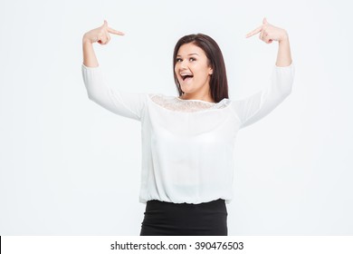 Cheerful businesswoman pointing finger at herself isolated on a white background