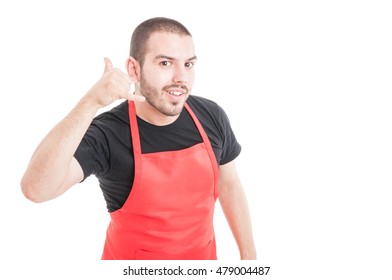 Cheerful butcher doing call gesture with hand isolated on white background - Powered by Shutterstock