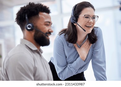 Cheerful caucasian call centre telemarketing agent training new mixed race assistant on in an office. happy supervisor troub - Powered by Shutterstock