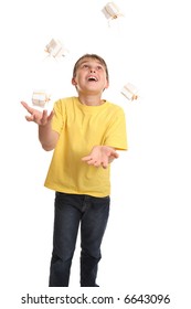 A Cheerful Child Dressed In Plain T-shirt And Denim Jeans Juggling Small Giftboxed Presents