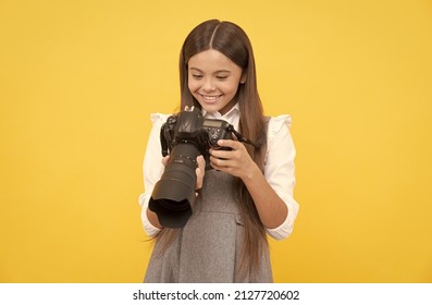 cheerful child girl take photo with digicam, photography