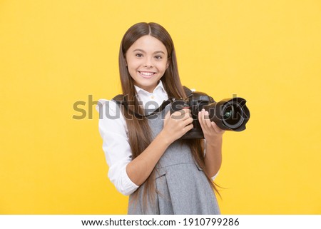 cheerful child girl take photo with digicam, photography.