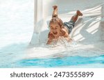 Cheerful Child on the Water Slide