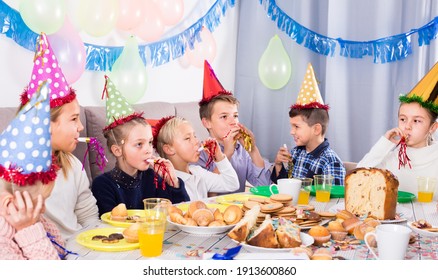 Cheerful children having good time during Christmas dinner