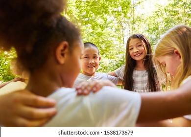 Cheerful children in a multicultural kindergarten form a circle - Powered by Shutterstock