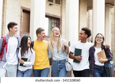 Cheerful college students walking together after study, resting in campus - Shutterstock ID 1451108060