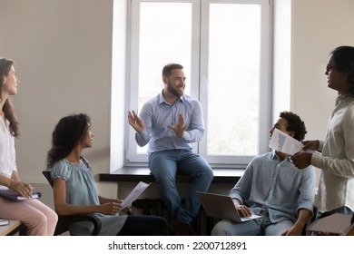 Cheerful Confident Business Team Leader Discussing Marketing Data, Sales Reports With Employees, Talking To Group On Department, Meeting, Laughing, Smiling, Analyzing Job Results