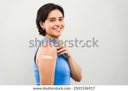 Similar – Image, Stock Photo Cheerful woman reflecting on urban building glass