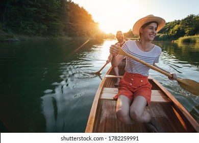 Cheerful couple enjoy summer boat ride on the lake, copy space