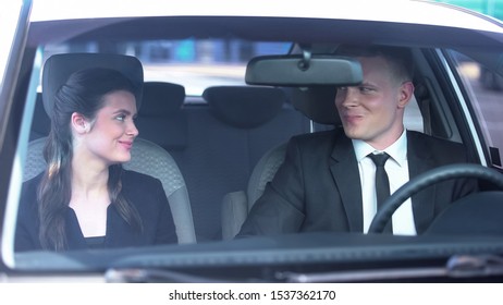 Cheerful Couple Smiling And Looking Flirtatiously In Car, Romance On First Date