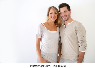 Cheerful Couple Standing On White Background