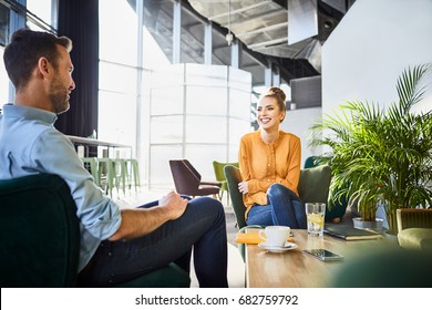 Cheerful Coworkers Chatting And Waiting For Lunch While On Break From Work In Cafeteria