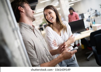 Cheerful Coworkers In Office During Company Meeting