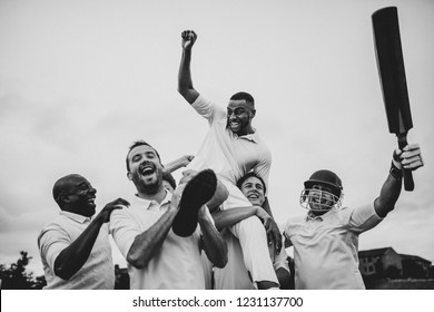 Cheerful cricketers celebrating their victory - Powered by Shutterstock