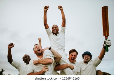 Cheerful cricketers celebrating their victory - Powered by Shutterstock