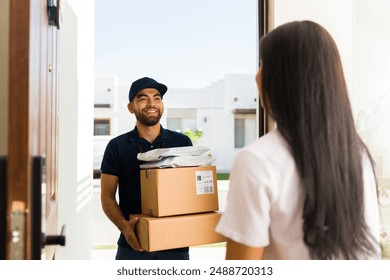 Cheerful delivery person provides exceptional service and efficient courier logistics by delivering packages to a customer's home with a smile - Powered by Shutterstock