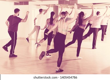 Cheerful Different Ages Adults Training Swing Steps At Dance Class