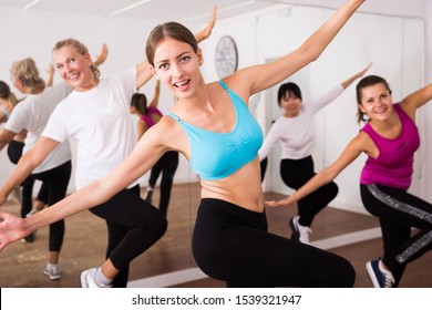 Cheerful Different Ages Women Learning Swing Steps At Dance Class