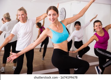 Cheerful Different Ages Women Learning Swing Steps At Dance Class