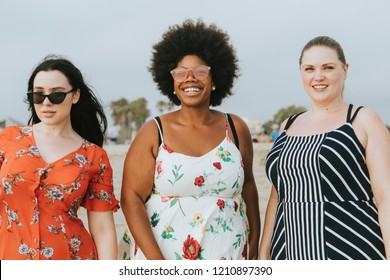 Cheerful diverse plus size women at the beach