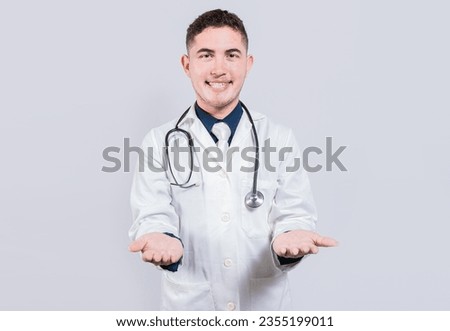 Cheerful doctor extending hands welcome. Friendly doctor extending hand in welcome isolated. Happy doctor extending hand to camera