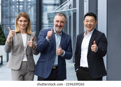 Cheerful Dream Team, Senior And Experienced IT Professionals In Business Suits Smiling And Happy Holding Thumb Up And Looking At Camera, Diverse Group Of Project Managers Outside Office Building.