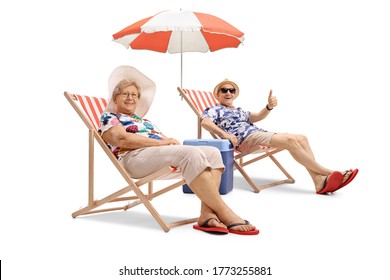 Cheerful elderly man and woman sitting on deckchairs and showing thumbs up isolated on white background - Powered by Shutterstock