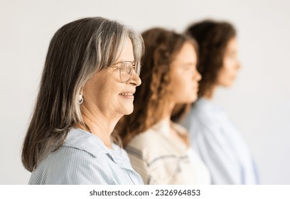 Cheerful european senior, mature and teen women and girl profile, isolated on white background, studio, close up. People tipe, family relationships, female generation and genetic - Powered by Shutterstock