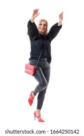 Cheerful Excited Joyful Middle Aged Well Dressed Woman Dancing With Outstretched Arms Reaching Up. Full Body Length Isolated On White Background.