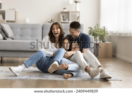 Similar – Image, Stock Photo Three children playing in the surf