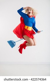 Cheerful Excited Superwoman Flying On Broom, Isolated On White