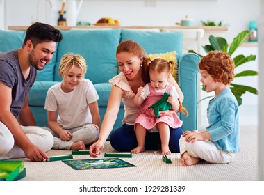 Cheerful Family Having Fun, Spending Time Together By Playing Board Games At Home