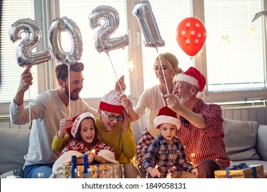 Cheerful Family Looking Forward New Year Presents In Festive Home Atmosphere. New Year, Holiday, Family Time Together