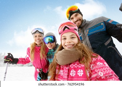 Cheerful Family Together On Skiing