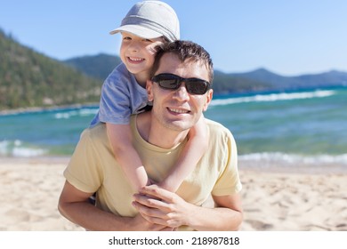 Cheerful Family Of Two Having Fun During Vacation At Lake Tahoe, California, Usa