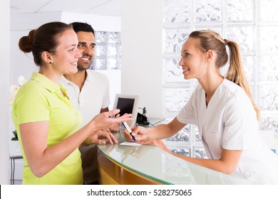 Cheerful Family In The Waiting Room Of The Clinic Family Planning