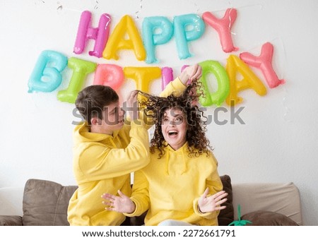 Similar – Image, Stock Photo Young happy couple enjoying a birthday party