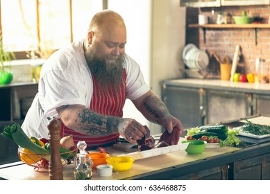 Cheerful Fat Man Enjoying Cooking At Home