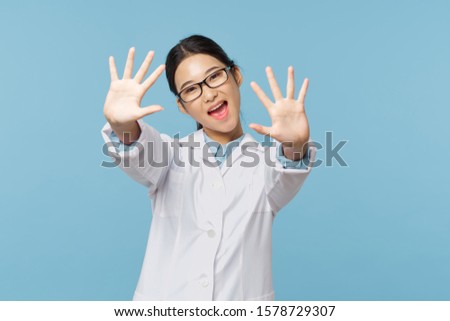 Cheerful female doctor latex safety gloves