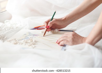 Cheerful Female Tailor Is Creating Bridal Gown