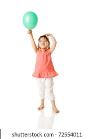 Cheerful five year girl holding balloon isolated on white