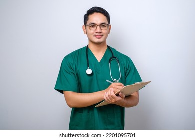 Cheerful Friendly Asian Male Physician, Doctor With Clipboard During Daily Checkup, Standing Over Isolated White Background