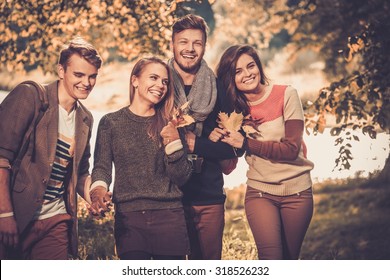 Cheerful friends in autumn park - Powered by Shutterstock
