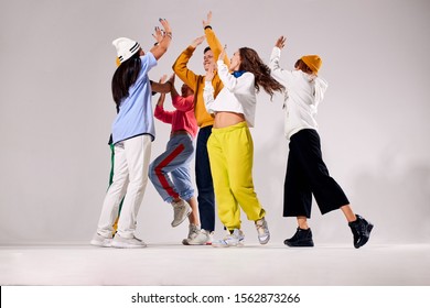 Cheerful Friends Clapping Hands In The Air, Gathered Together, Expressing Happiness, Celebrating Winning Of Gold, Playfully Jumping, Congratulating Each Others, Hip Hop Dance Competition