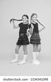 Cheerful friends. Cute little girls smiling yellow background. Happy small girls wearing same outfits. Friends enjoying friendship. Playful kids. Happy together. School friends having fun together. - Shutterstock ID 1534341098