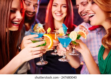 Cheerful Friends With Fresh Cocktails