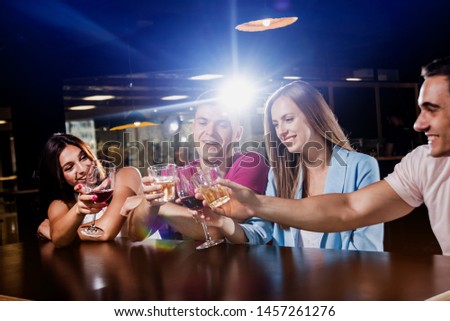 Similar – Image, Stock Photo Young business people on the roof terrace at the Afterwork Beer