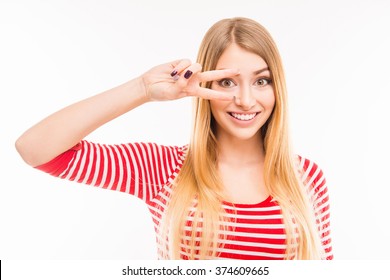 Cheerful Girl Gesturing With Two Fingers Near Eyes