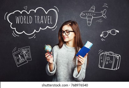 Cheerful Girl Holding Passport, Plane Ticket And Globe Before Grey Background, Indoor Travel Concept