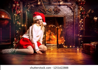 A cheerful girl is at home with festive decorations. Merry Christmas, Happy New Year. Miracle time. - Shutterstock ID 1251622888